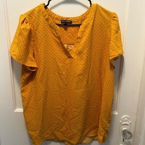 Yellow and white polka dot blouse